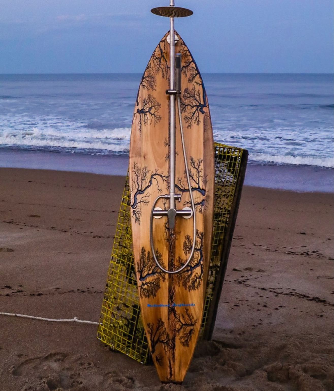 Custom surfboard shower on the beach